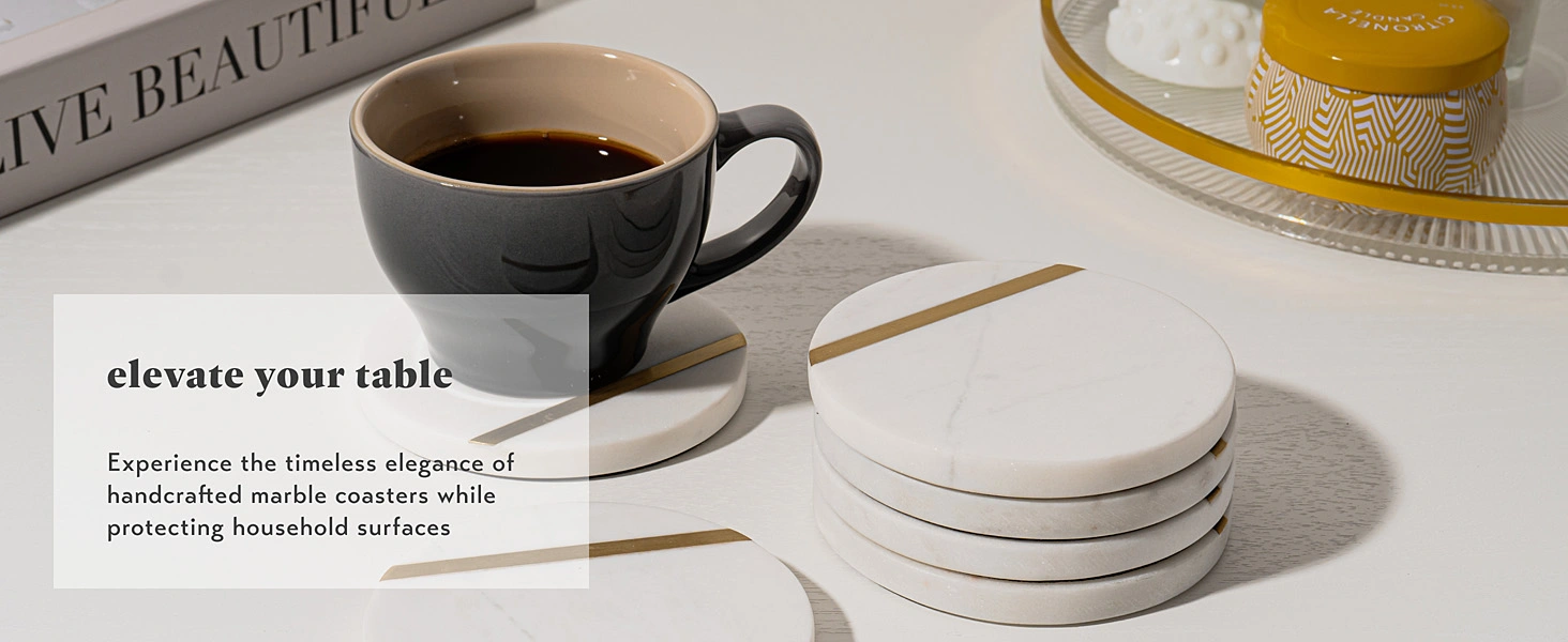 a set of white round marble coasters on an elegant coffee table
